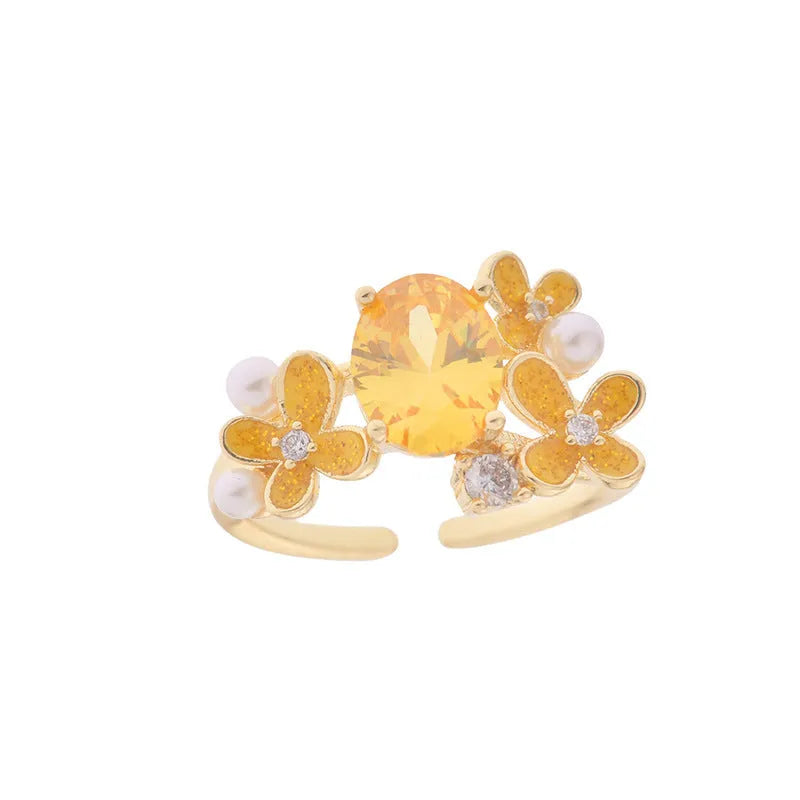 Women's open ring with flower pearl design and zircon details in yellow colour