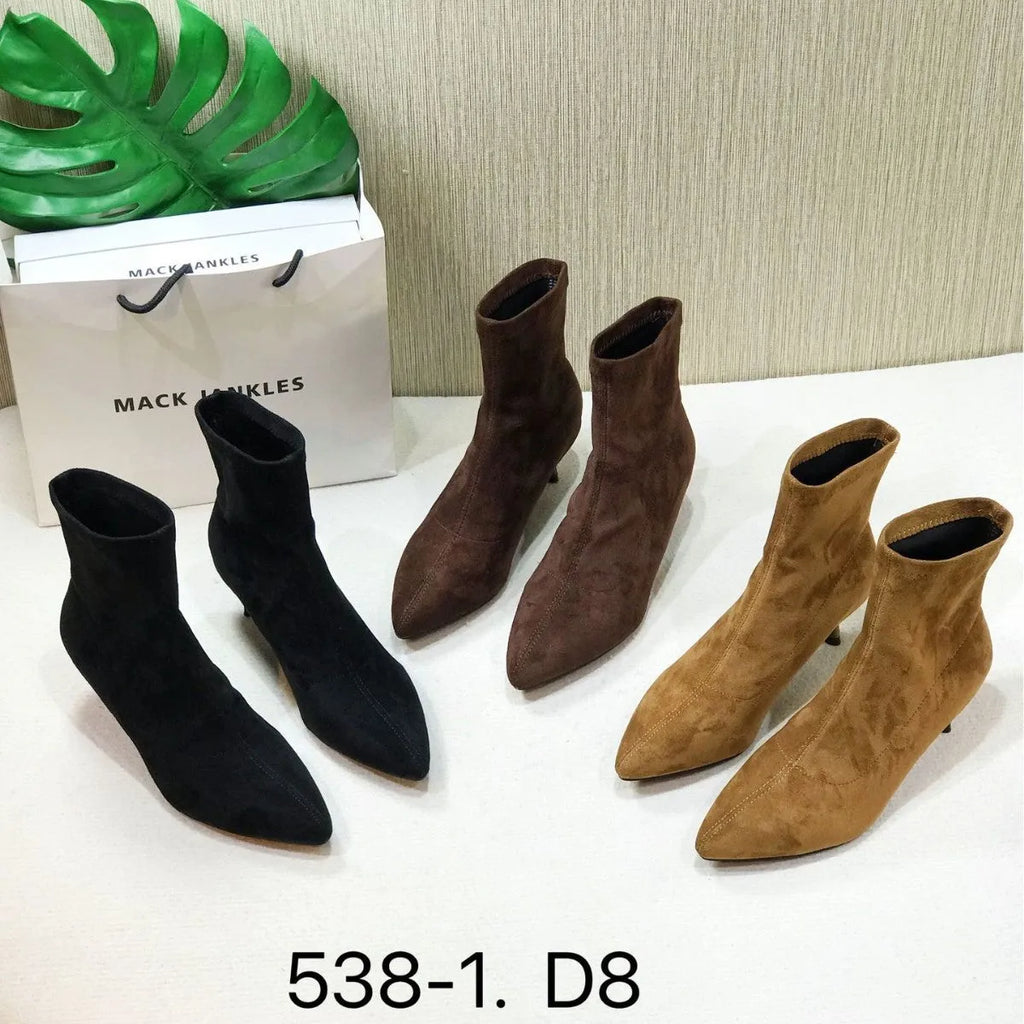Women's black pointed toe ankle boots with a high stiletto heel on a microfiber upper.