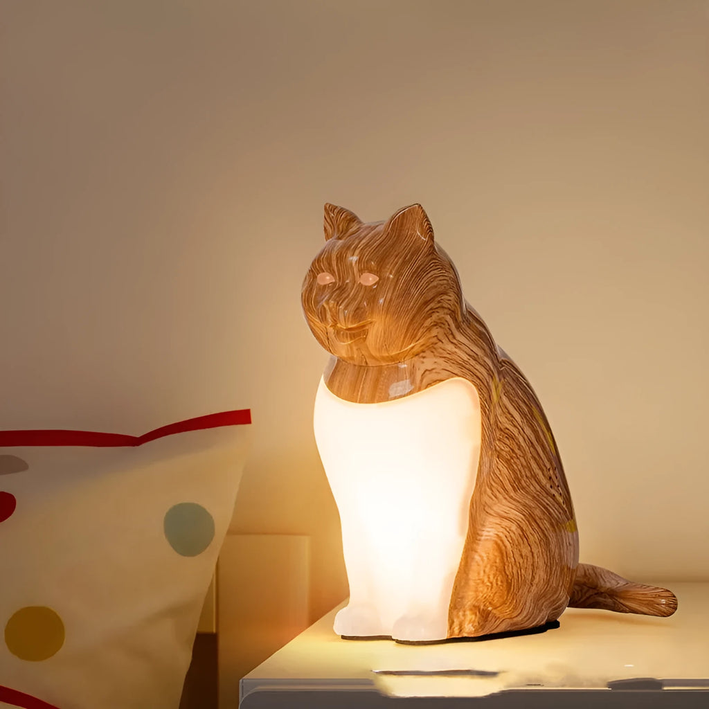 Decorative table lamp with cat ornaments featuring USB charging port and adjustable colour temperature settings