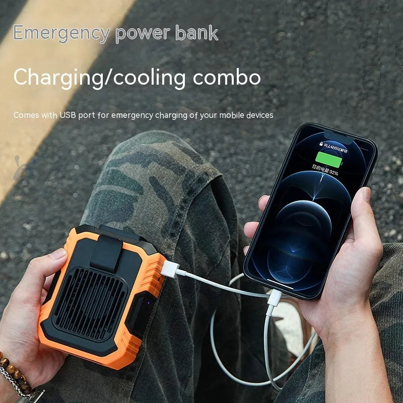 Green wrist-hanging personal fan with USB port and LED light, showing compact design.