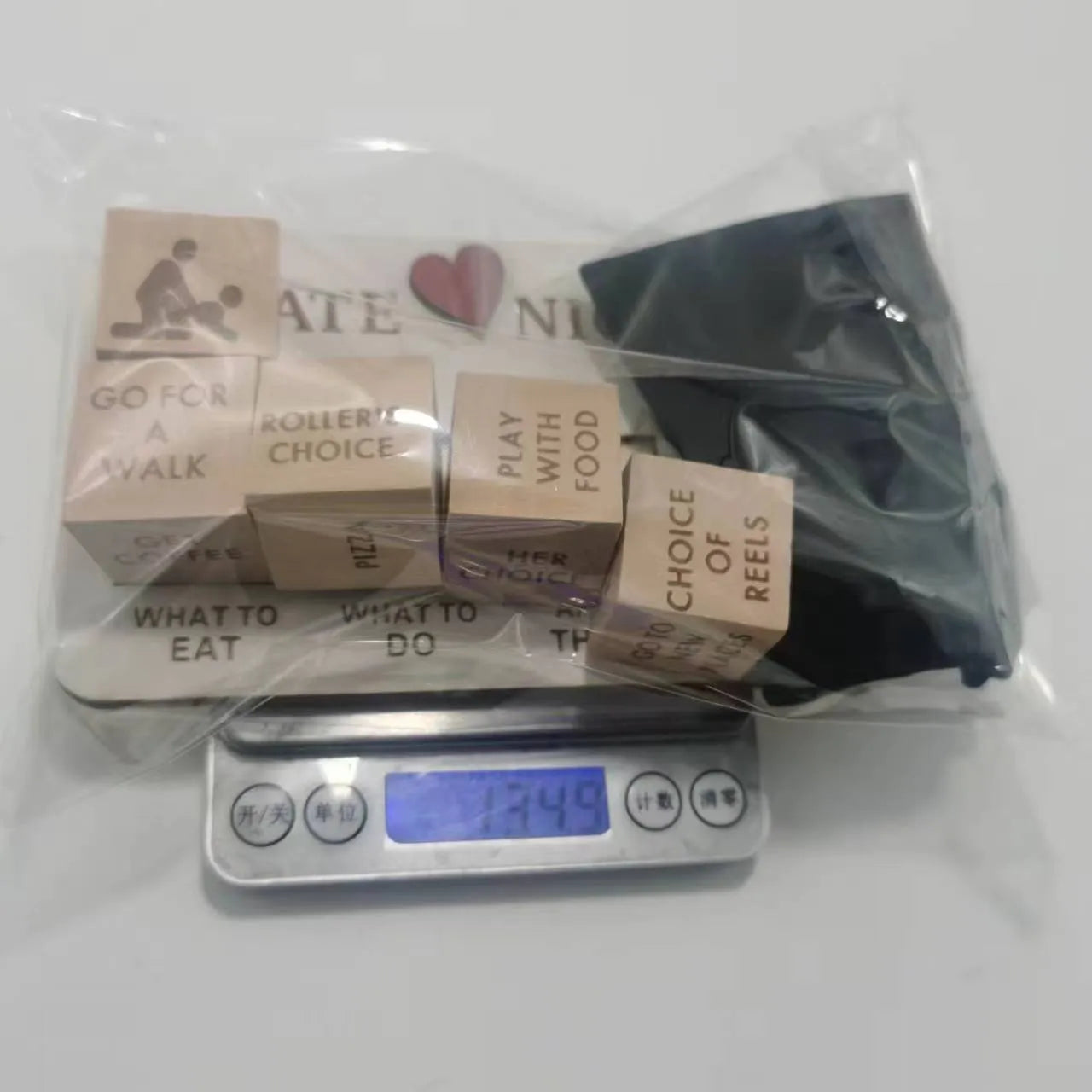 Wooden date night dice set with five dice, date planner board, and black storage bag