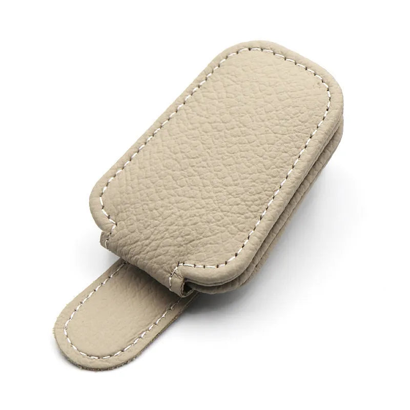 Car sunglasses holder clip with PU leather case attached to vehicle sun visor