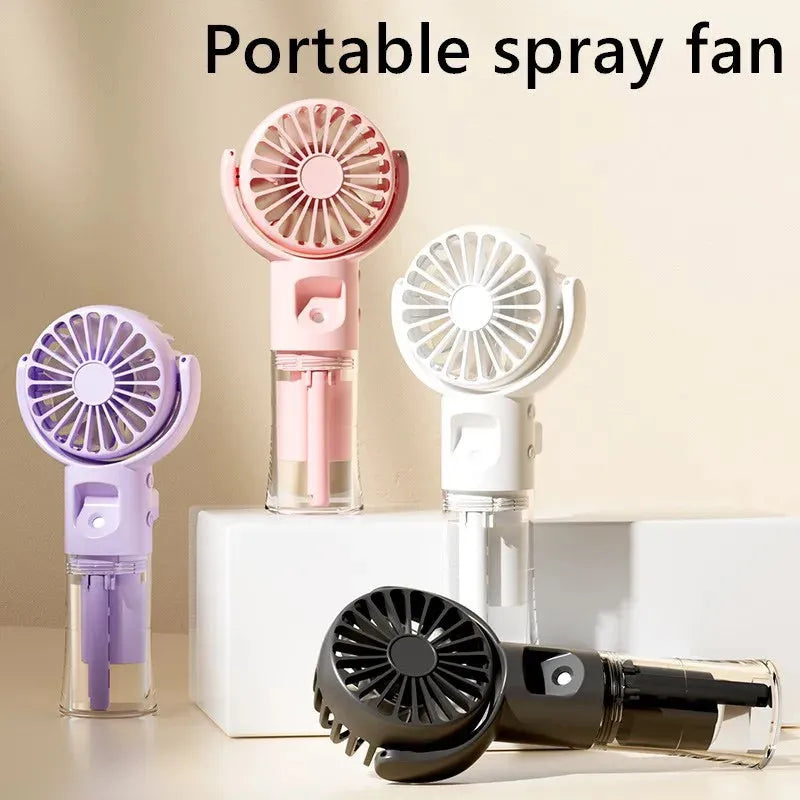 Handheld portable mist fan in various colours with transparent water tank and control button.