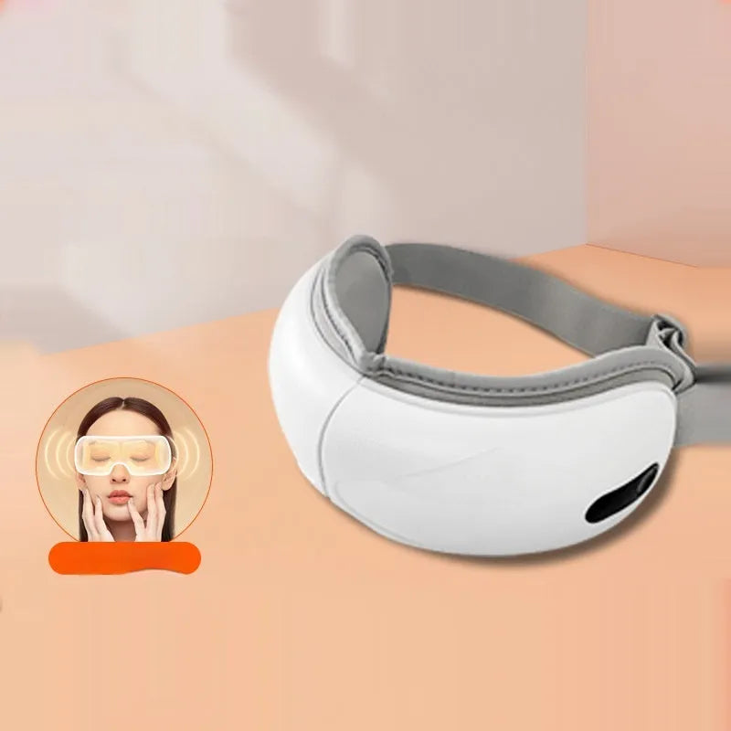 White rechargeable eye massager with hot compress and airbag massage, dimensions 140x52x150mm