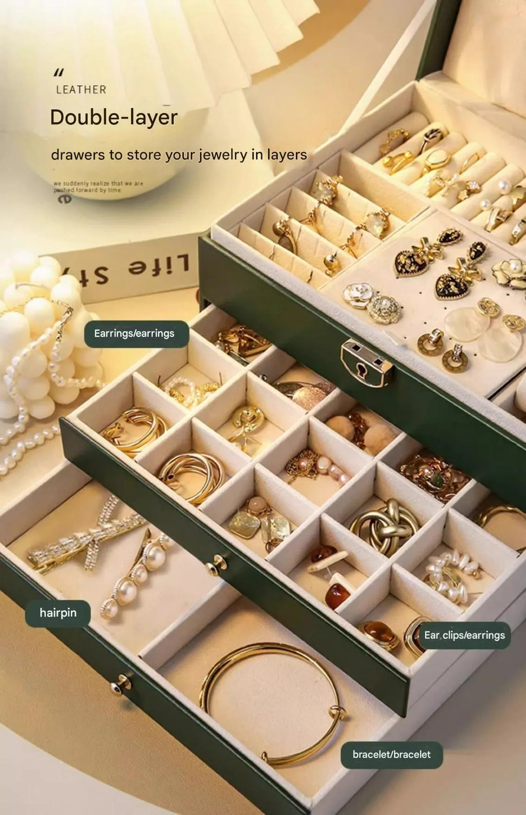 Leather jewellery storage box with three drawers open, showing storage for necklaces, earrings, and bracelets.