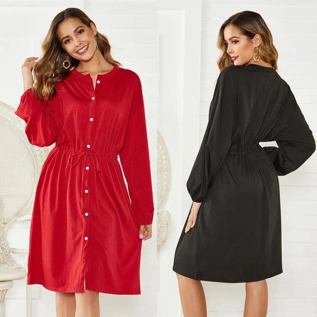 Black A-line dress with elastic waist and cinched belt, mid-length skirt, long sleeves
