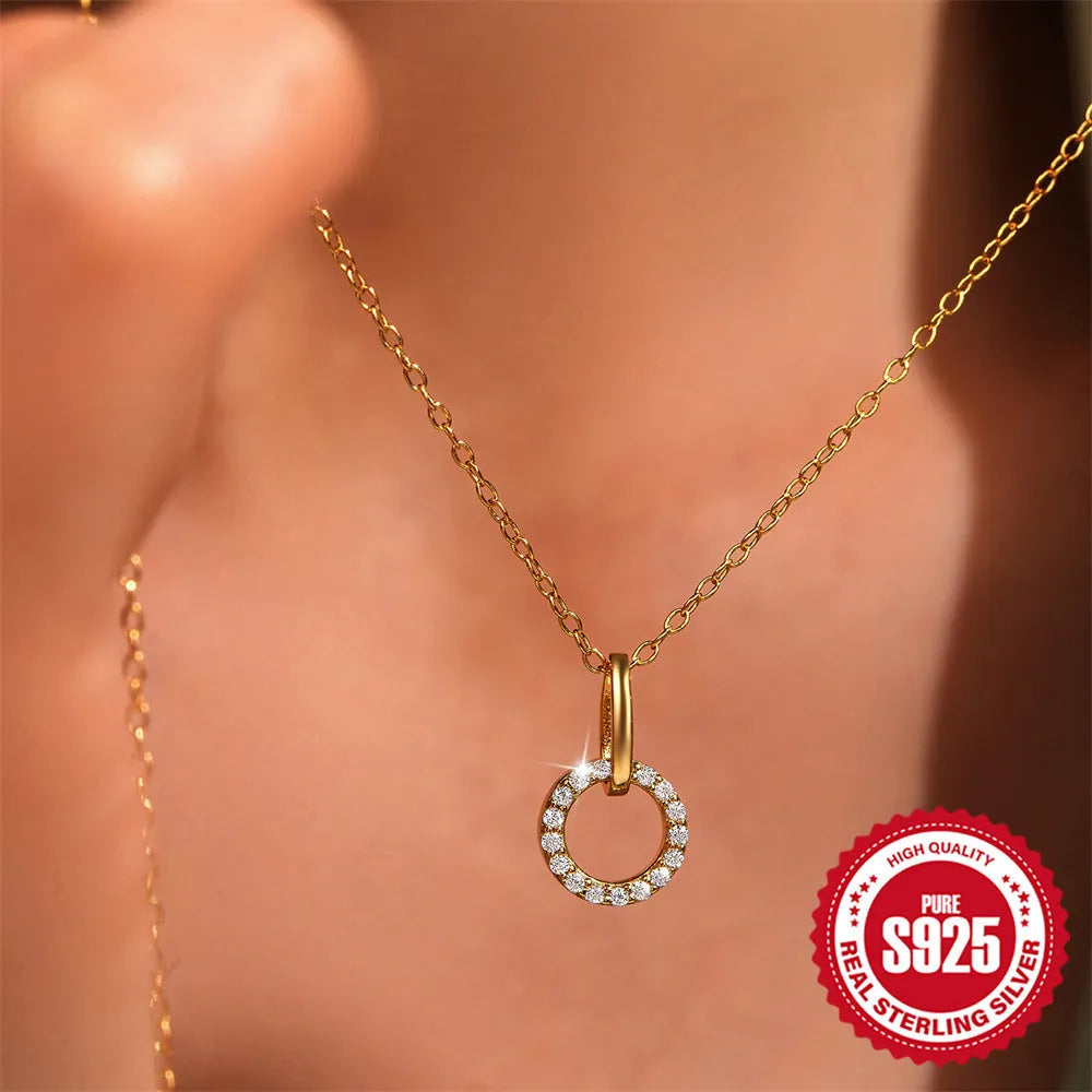 Gold colour geometric interlocking zircon pendant on an adjustable S925 sterling silver clavicle chain.