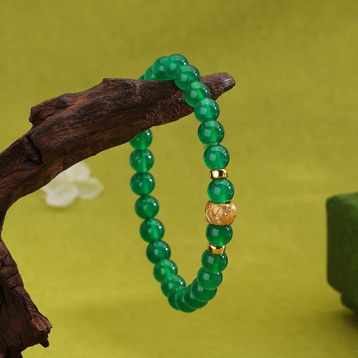 Green agate and sterling silver bracelet with yellow gold plating and a geometric bead.