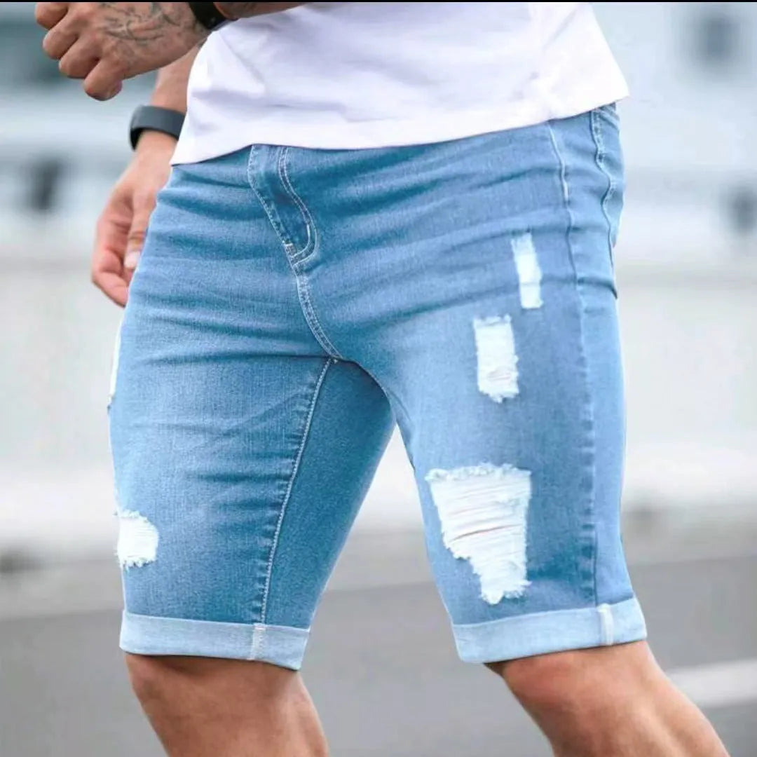 Sky blue men's denim shorts with manual distressing and multi-hole detailing on straight-leg cut