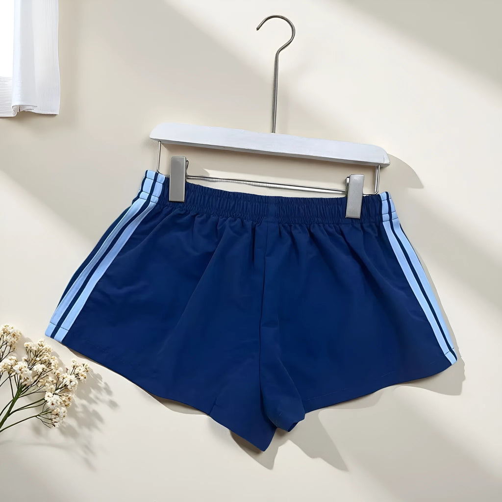 Navy blue men's high-waist nylon sports shorts on a white background