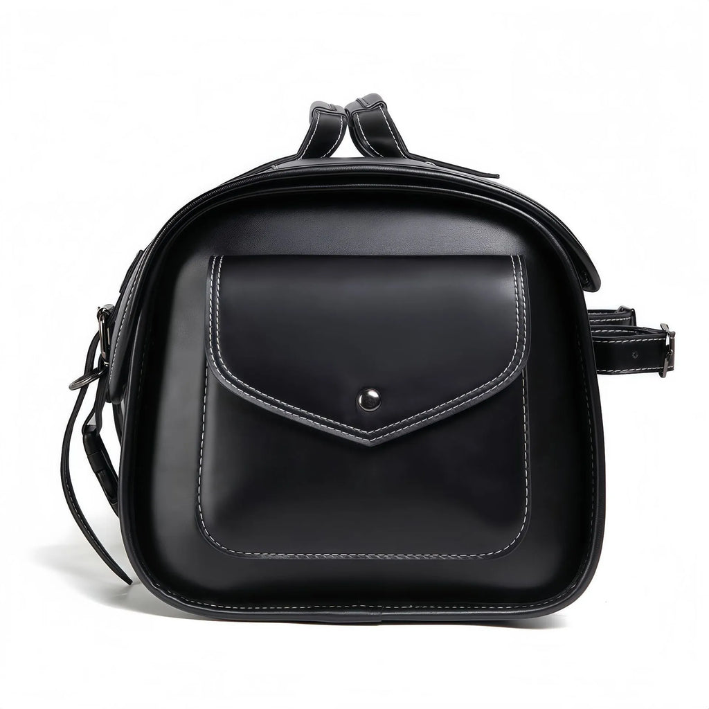 Dark punk motorcycle tail bag with coded lock mounted on cruiser motorcycle