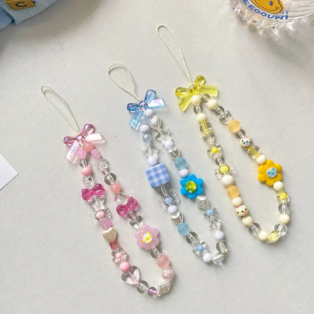 Beaded flower mobile phone lanyard with plastic/resin floral beads on 1.2m adjustable rope in blue, pink, or yellow colour options