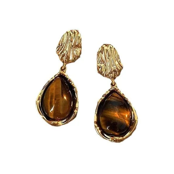 Handmade holiday earrings with three geometric styles: round, irregular, and water drop designs with tassel elements