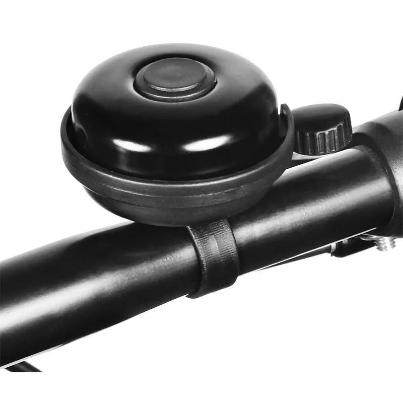 Black ABS plastic bicycle bell with 58mm diameter on a handlebar.