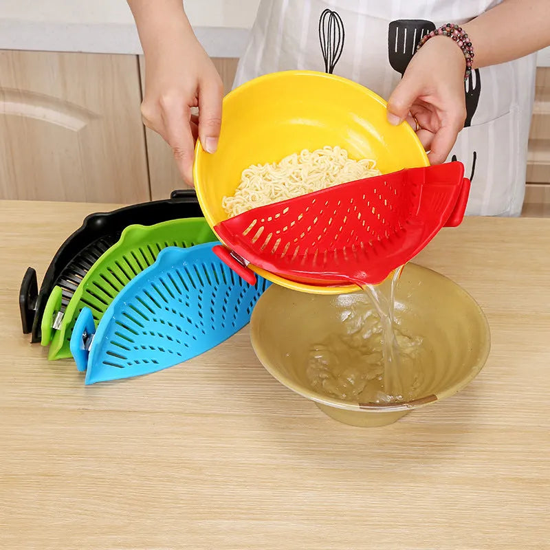 Silicone clip-on kitchen strainer with stainless steel mesh attached to pot rim for draining liquids