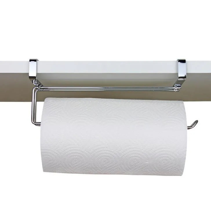 Silver stainless steel cabinet door back hanging paper towel rack on a kitchen cabinet.