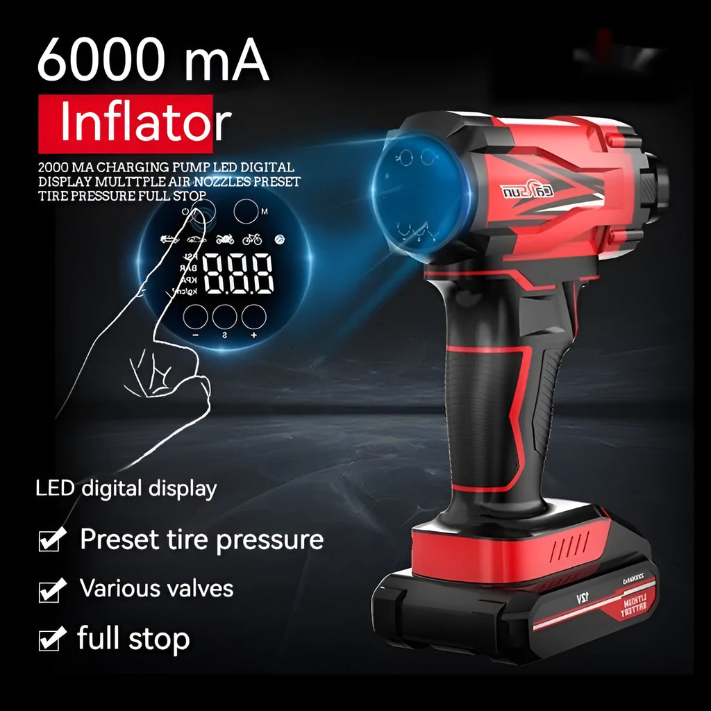 Red and black portable car tyre air pump with display, nozzles, and power cables on a table.