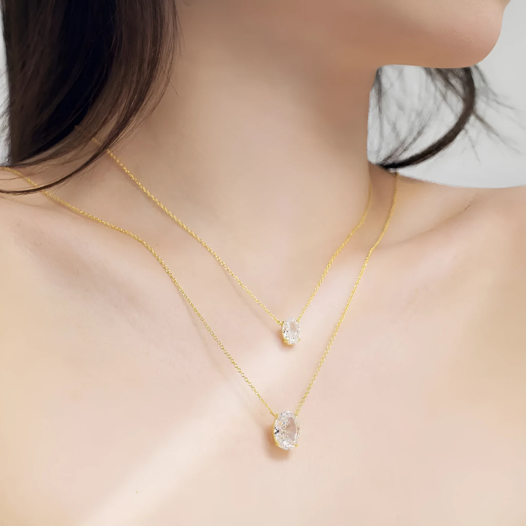 S925 sterling silver oval pendant necklace in geometric style on a model.