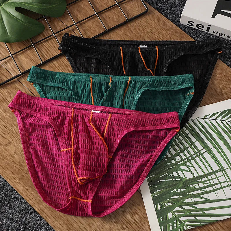 Men's solid colour low waist lace briefs for sports in white, black, green, rose red, and light purple.
