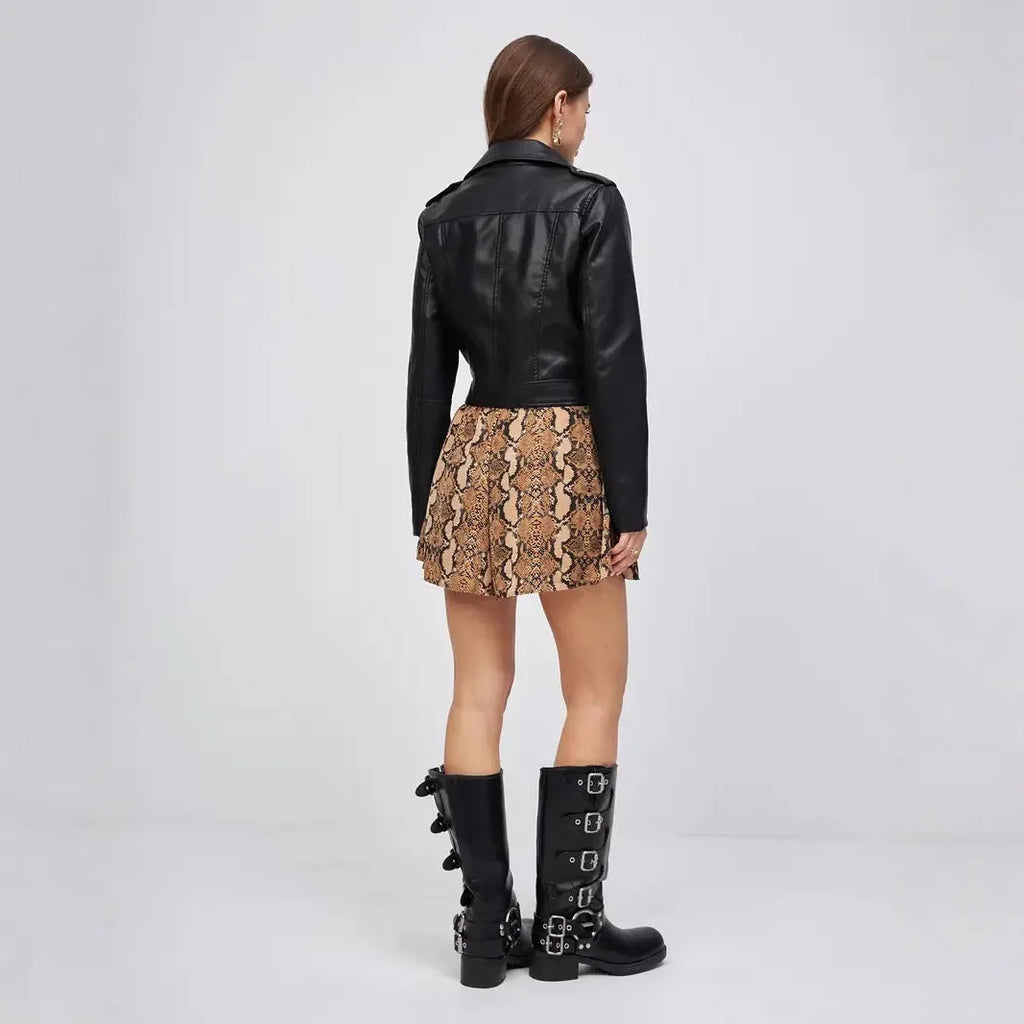 Black women's imitation leather locomotive jacket with regular sleeves on size chart background