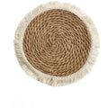 Round Japanese straw placemat with decorative tassels in natural papyrus colour, showing handwoven texture