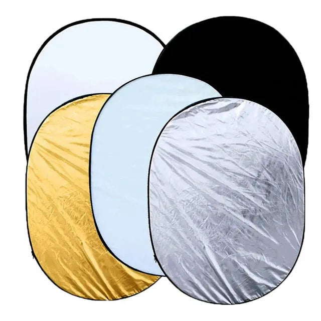 Collapsible photography light reflector with gold, silver, white, black and translucent surfaces