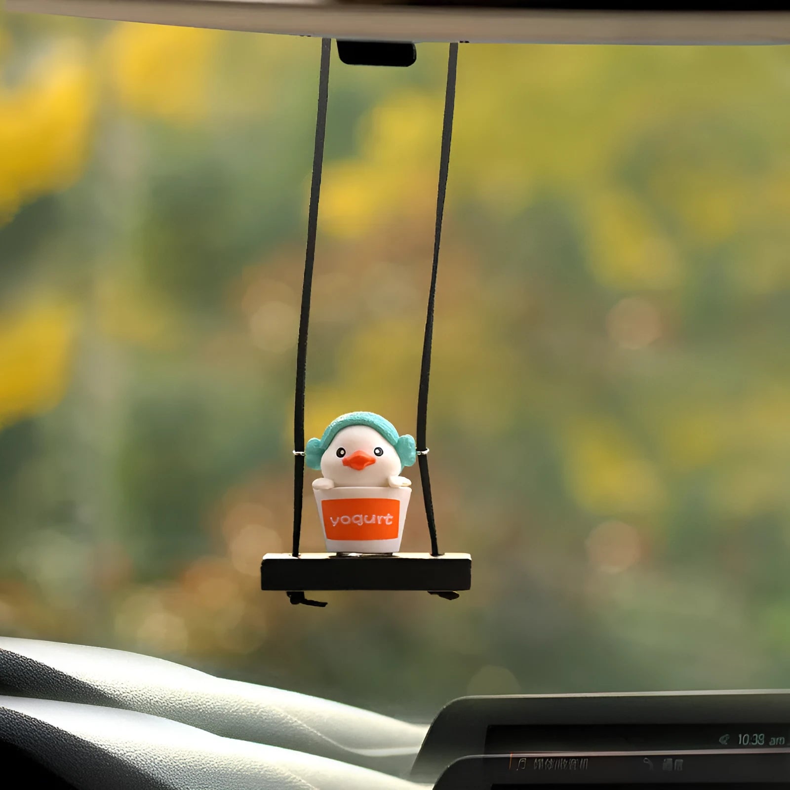 Cute yellow cartoon duck doll car hanging ornament in four design variations.