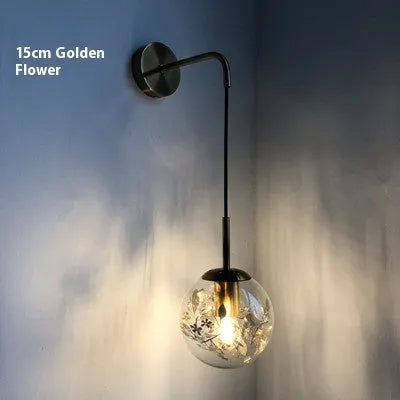 Glass bedside wall lamp with LED lighting in golden flower finish measuring 20cm diameter