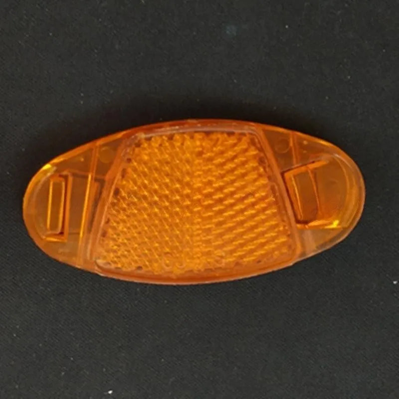 Bicycle reflector spoke decoration in white or yellow, measuring 7.2cm by 3.5cm for night-time cycling safety