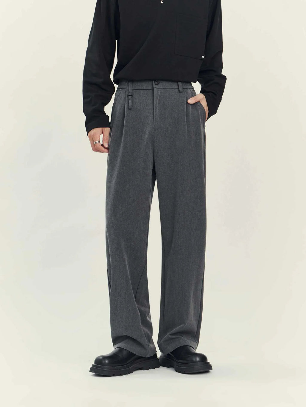 Black draping straight-leg business casual trousers on hanger
