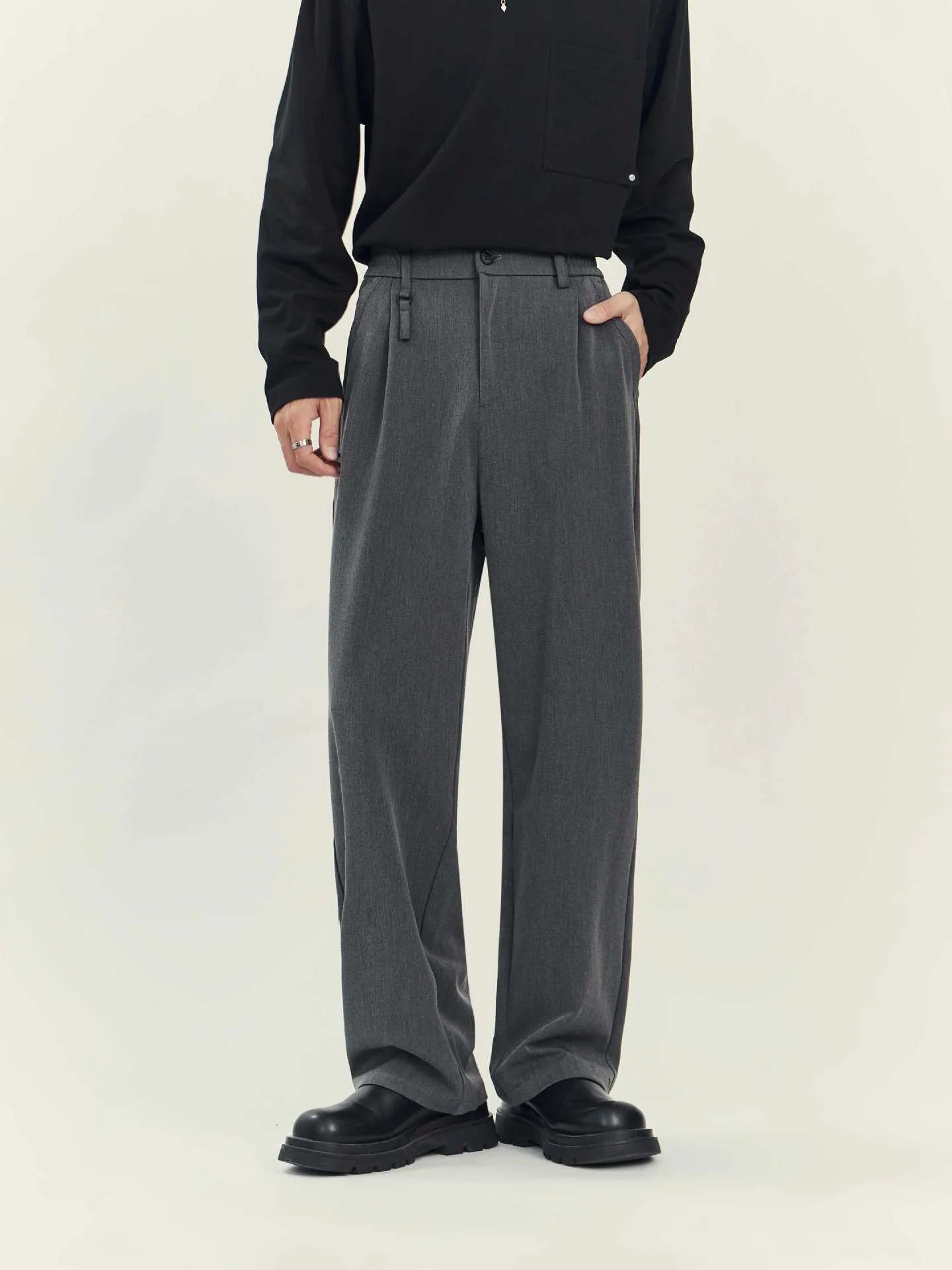 Black draping straight-leg business casual trousers on hanger