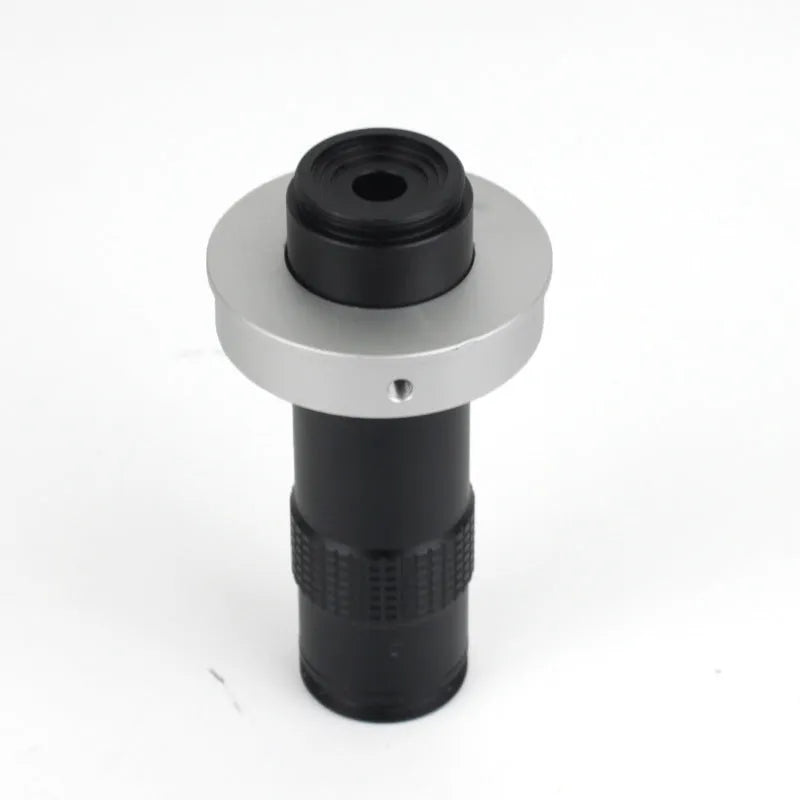Black metal industrial camera monocular lens for 130x magnification with 60-300mm working distance.