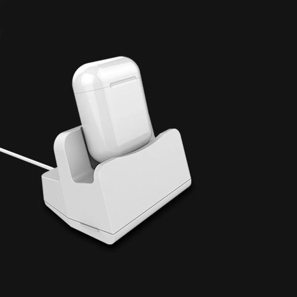 White headphone charging base station with fashion last design on flat surface