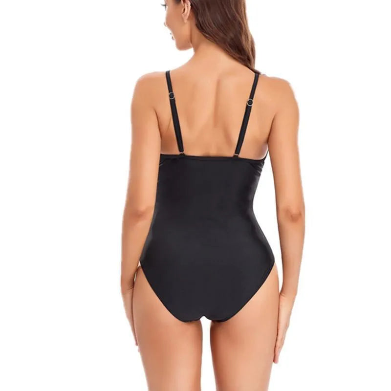 Ladies' solid colour mesh one-piece swimsuit with backless design in black or blue options