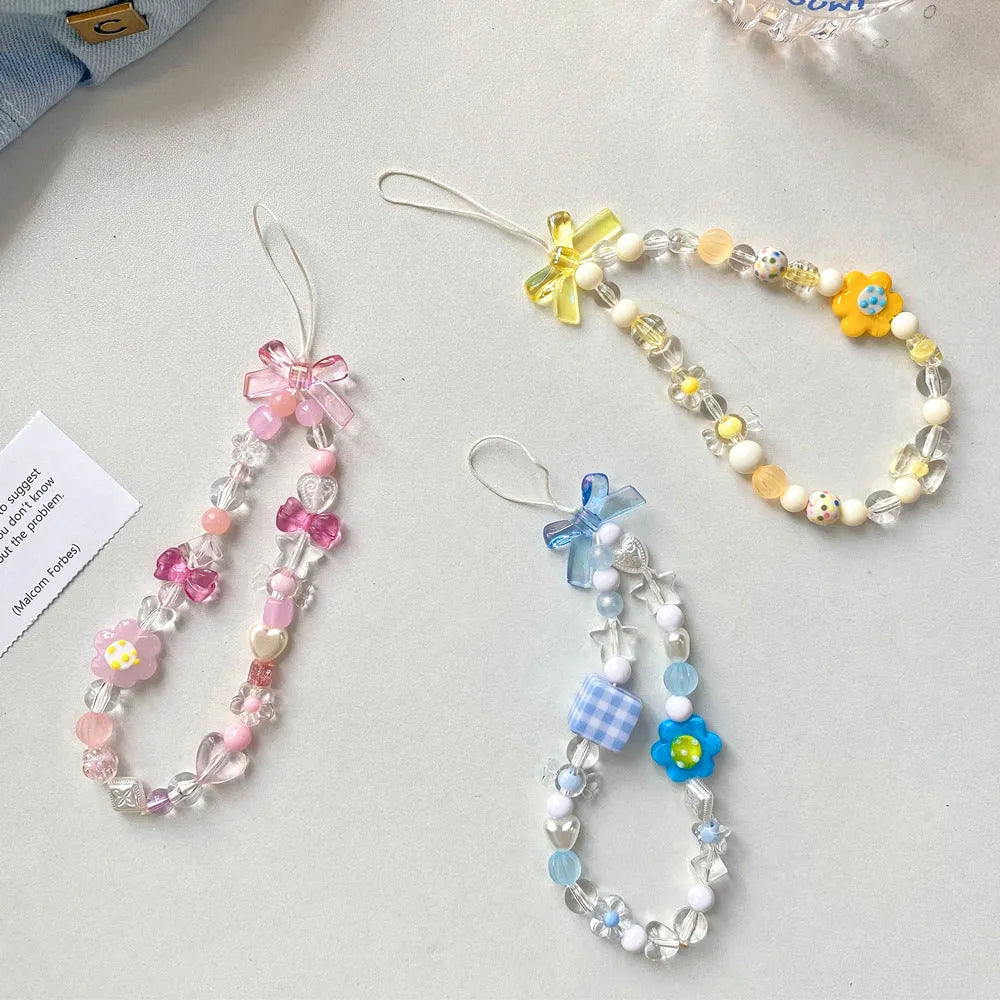 Beaded flower mobile phone lanyard with plastic/resin floral beads on 1.2m adjustable rope in blue, pink, or yellow colour options