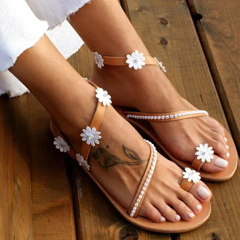 Brown ladies casual beach Roman sandals with herringbone toe and floral pattern on artificial PU upper