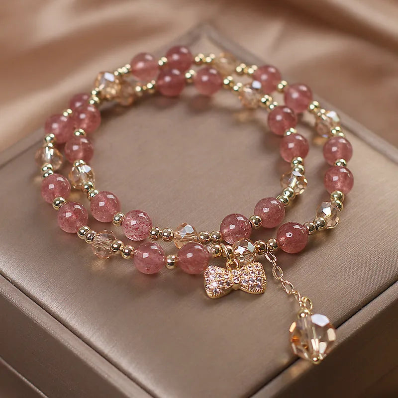 Women's double layer strawberry quartz bracelet with lucky cat charms in red cat's eye flowers colour