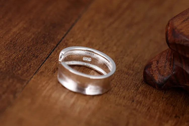 Geometric adjustable opening frosted sterling silver ring on finger