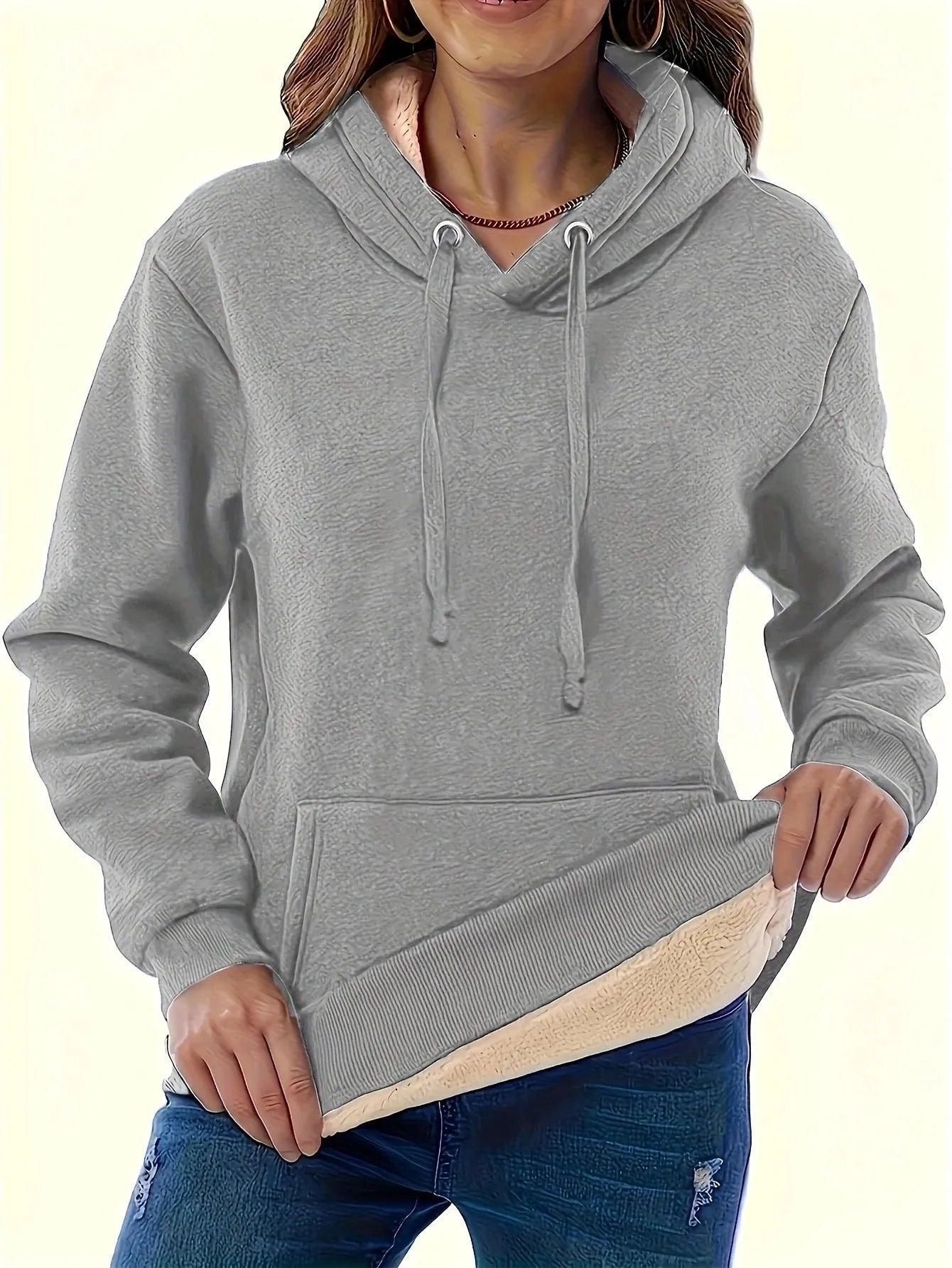 Women's black hooded sweater with a textured 3D pattern, loose fit, and front pockets.