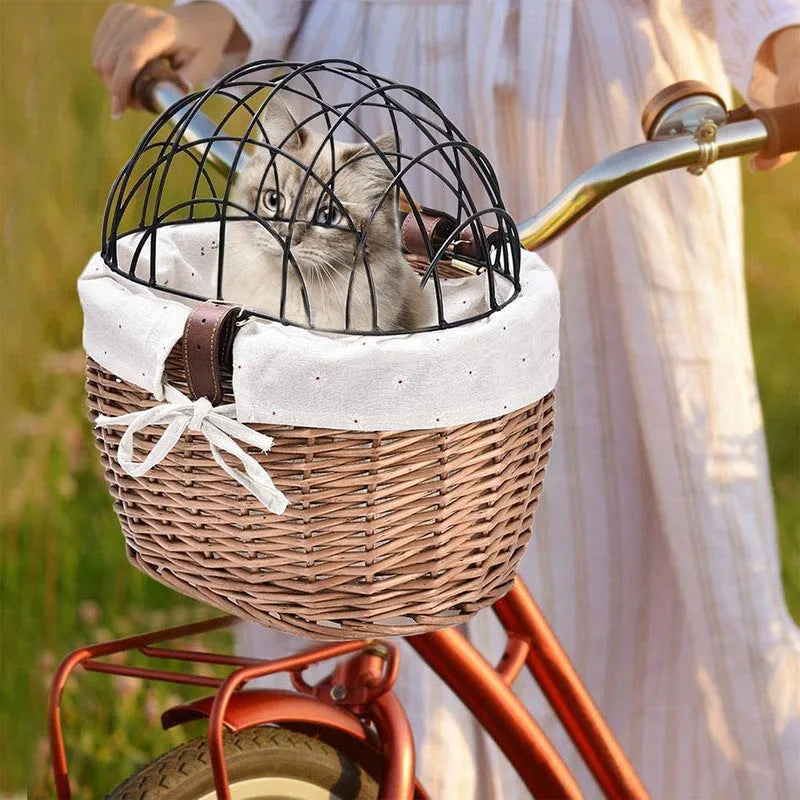 Honey colour wicker bicycle front handle basket, medium size, used as a pet seat for a cat or dog on a road bike