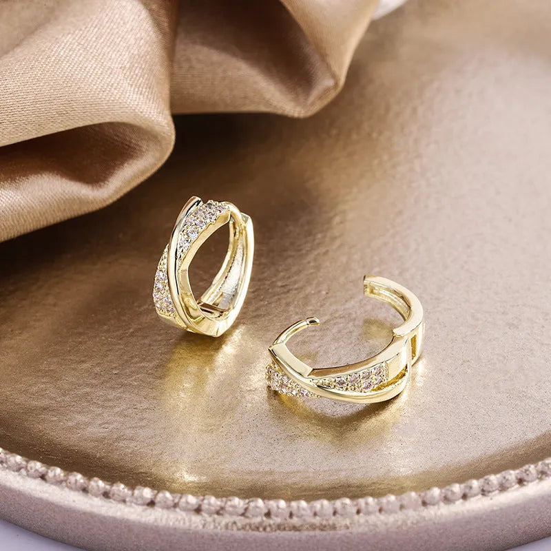 Geometric stud earrings with 14K yellow gold plating and zircon accents on copper base