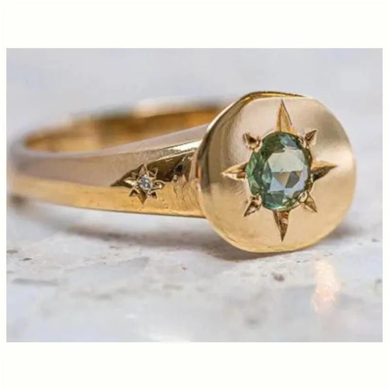 Golden adjustable ring with oval asterism zircon centre and micro inlay star pattern on zinc alloy band