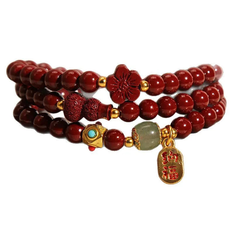Red cinnabar bracelet with geometric gourd and flower design, 6mm diameter with clasp fastening