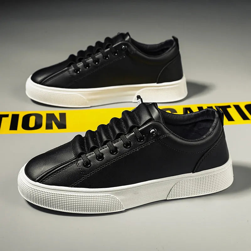 Men's low-top black and white sports casual shoes with synthetic leather upper and round toe.