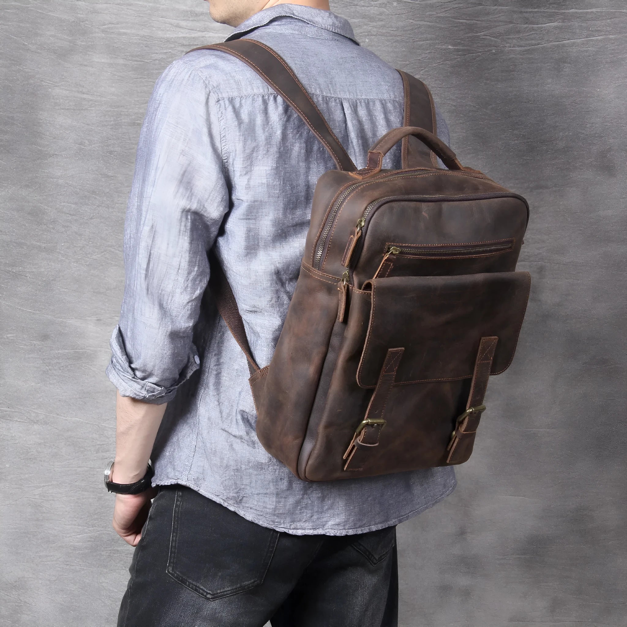 Dark coffee coloured handmade leather backpack with internal computer and mobile phone pockets.