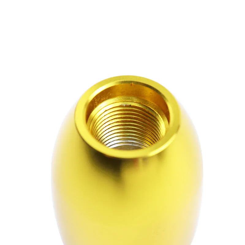 Polished aluminum gear shift knob with three rubber adapter sleeves for manual transmission vehicles