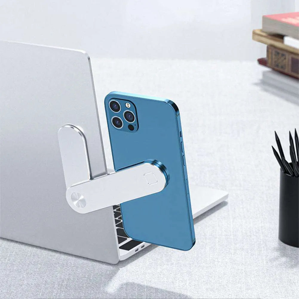 Black aluminium laptop phone holder with magnetic bracket mounted on a monitor, showing a smartphone attached for dual-screen use