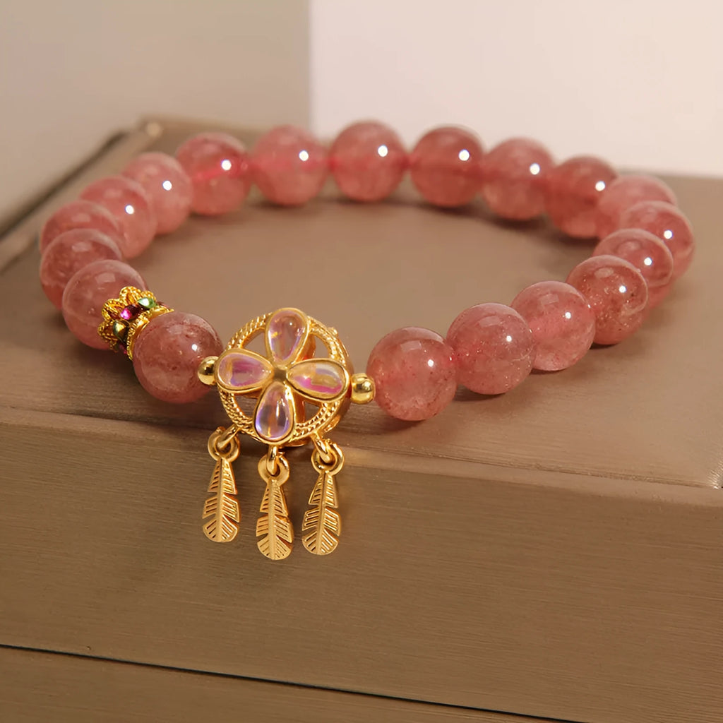 Strawberry quartz women's bracelet with four leaf clover dream catcher design and ball pendant charm