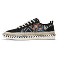 Men's round toe casual cloth shoes in beige and black on a plain background.