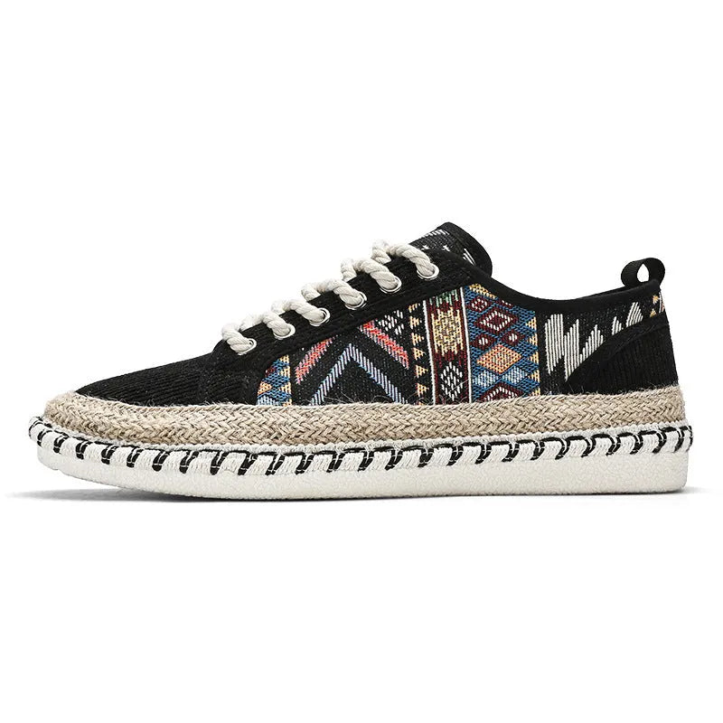 Men's round toe casual cloth shoes in beige and black on a plain background.